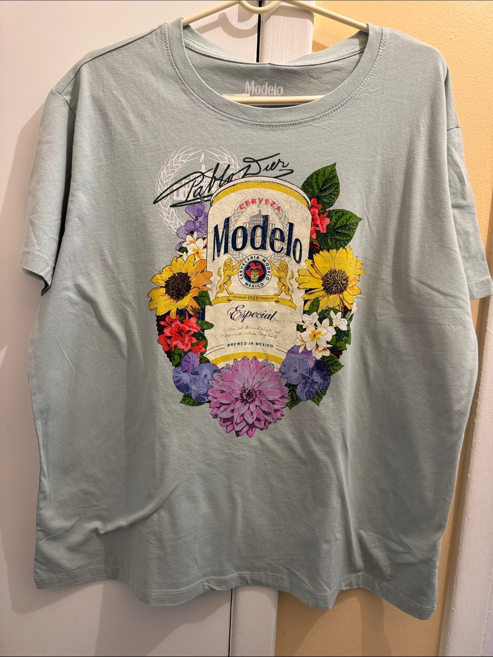 ModelCo light turquoise floral logo tee
